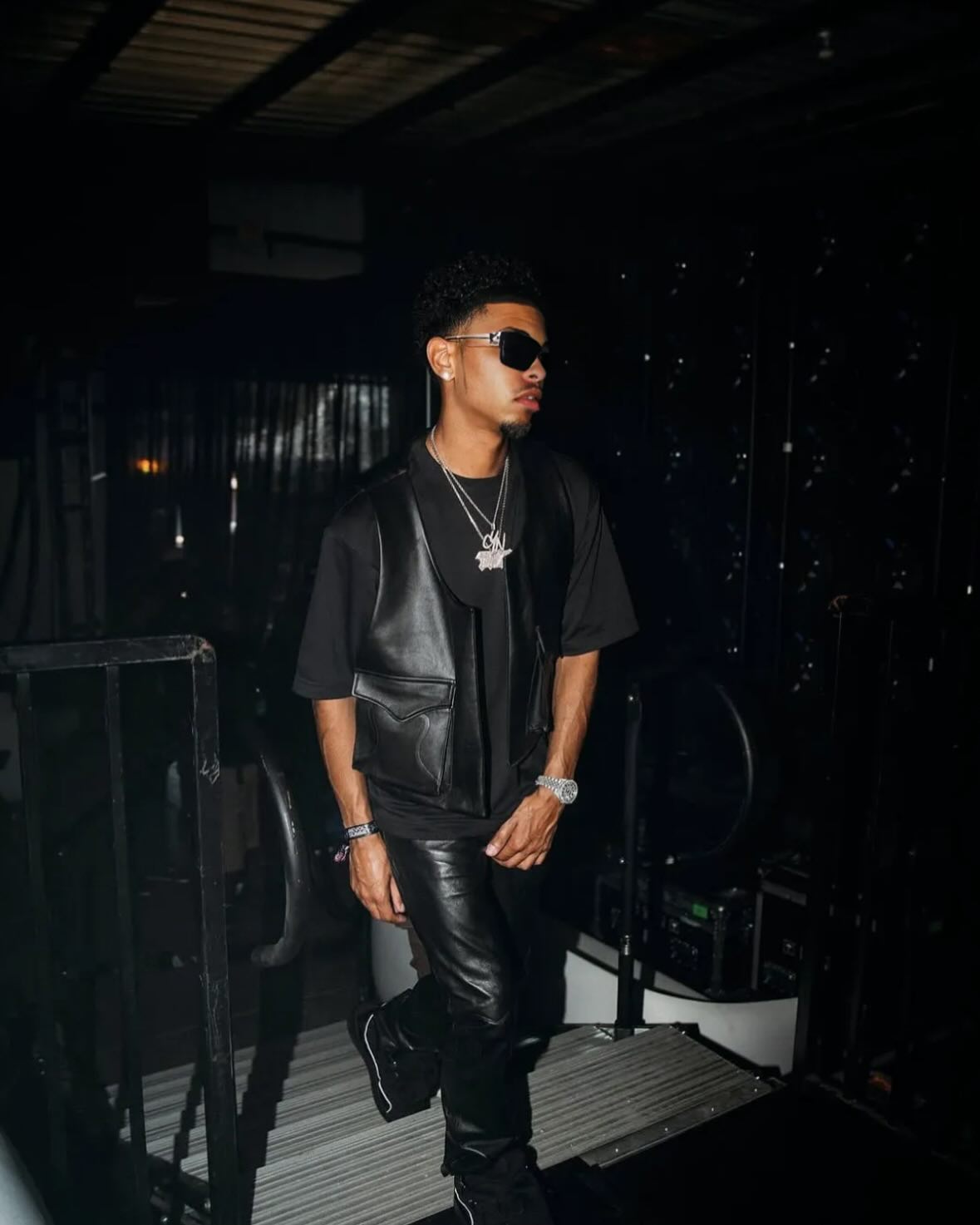 CJ WestCoast in sunglasses and layered silver chains