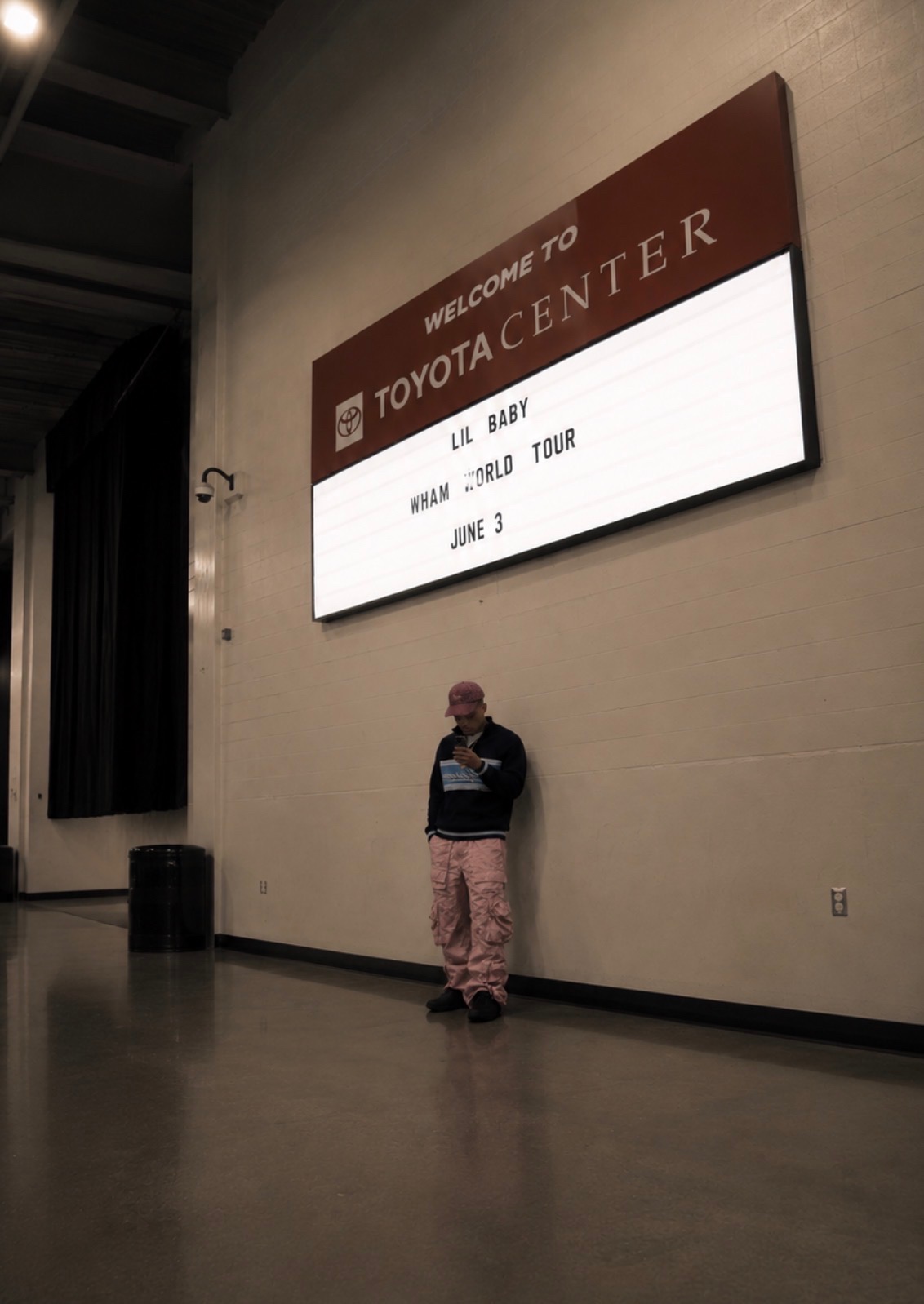 CJ WestCoast under the Welcome to Toyota Center sign for the Lil Baby WHAM World Tour